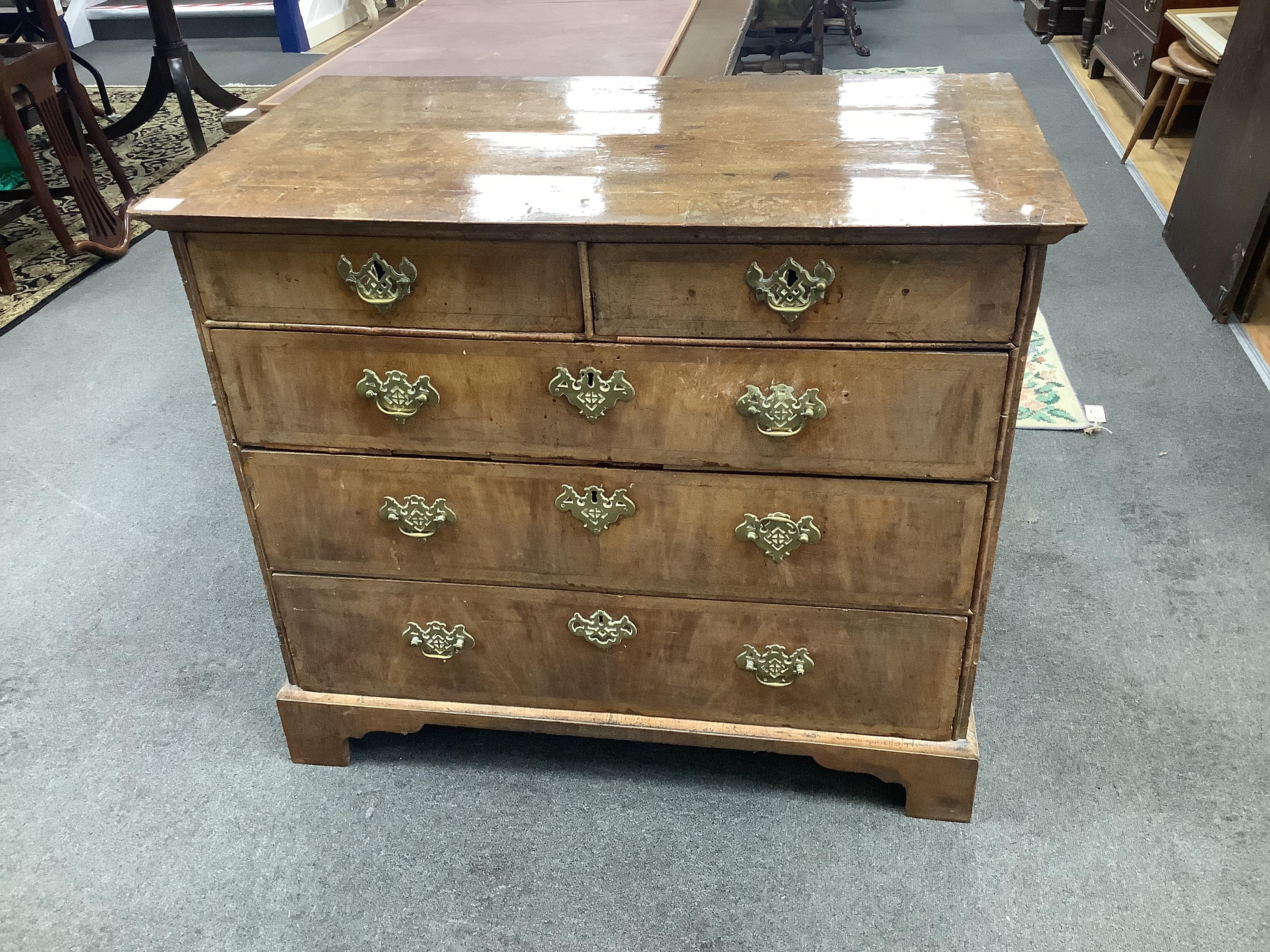 An 18th century feather banded walnut chest of two short and three long drawers, width 96cm, depth 55cm, height 82cm